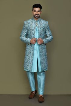 Firozi blue full sleeves layered sherwani crafted in jacquard silk with vine bloom pattern detailing on the outer layer and plain inner layer. Paired with an Aligadhi pant. - Aza Fashions Long Sleeve Banarasi Silk Sherwani With Dabka, Blue Sherwani With Naqshi Long Sleeve, Blue Long Sleeve Sherwani With Naqshi Detailing, Blue Sherwani With Naqshi In Traditional Drape, Blue Sherwani With Naqshi And Traditional Drape, Blue Brocade Kurta For Wedding, Blue Raw Silk Sherwani, Blue Art Silk Sherwani For Eid, Transitional Blue Raw Silk Sherwani