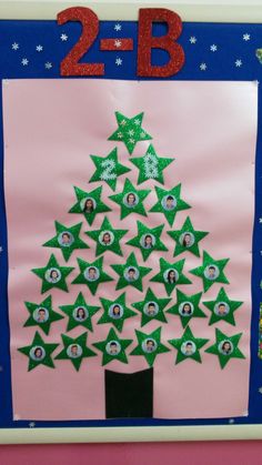 a christmas tree made out of paper on a bulletin board