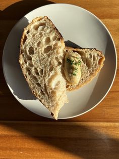 a white plate topped with a piece of bread