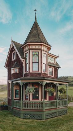 an old victorian style house in the middle of nowhere