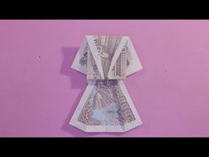 an origami tie made out of money