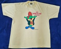 VINTAGE 1993 Dig 'Em KELLOGGS Feeling Gr-r-reat Fun Walk T SHIRT  XL *Rare*  26" x L 33" W 22 1/2" Pit to Pit, 16 1/2 " Pit to Hem, 71/2" Sleeve 21" Shoulder to Shoulder Small Stains under logo.  Logo is distressed with age but intact (see photos) Fun Walk, Walking, Mens Graphic Tshirt, Feelings, ? Logo, Mens Tshirts, Mens Tops, T Shirt, Quick Saves