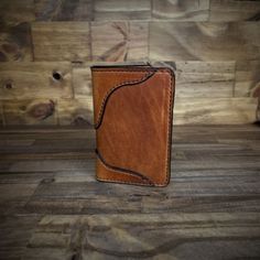 This is my Montana Western vertical wallet. My best seller it is shown in Chestnut and Tan 2 Toned. It measures 3.125 x 4.625 Closed Leather. Being a natural material, the shade of leather will vary with every wallet made. Rustic Brown Bifold Wallet, Brown Trifold Card Holder For Daily Use, Rectangular Cognac Leather Trifold Wallet, Cognac Leather Rectangular Trifold Wallet, Brown Trifold Wallet For Daily Use, Cognac Leather Trifold Wallet, Brown Trifold Card Holder With Smooth Grain, Brown Leather Trifold Wallet, Rustic Brown Wallets With Card Slots