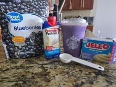 the ingredients to make blueberry smoothie are sitting on the counter next to an ice cream bag