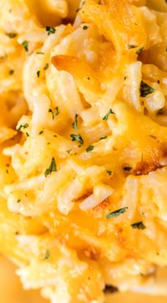 closeup of macaroni and cheese with parsley on the top, ready to be eaten