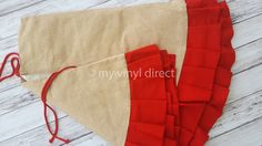 a piece of cloth with red thread on it and some other pieces of fabric next to it