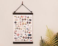 a poster hanging on the wall with various stickers and magnets attached to it