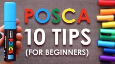 a hand holding a blue marker with the words posca 10 tips for beginners