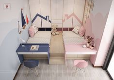 two beds in a small room with pink and blue decor on the walls, along with other furniture