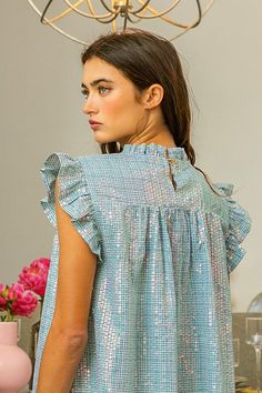 Add some sparkle to your wardrobe with our Sequin Gingham Smocked Top! This playful top features a smocked design and sparkling sequins, perfect for adding a touch of fun to any outfit. Don't just blend in, stand out with this unique and stylish top! Stylish Top, Smocked Top, Smocking, Gingham, Sequin, Sparkle, Wardrobe, Blue, Design