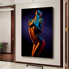 an abstract painting of a naked woman in blue and orange colors on a white wall