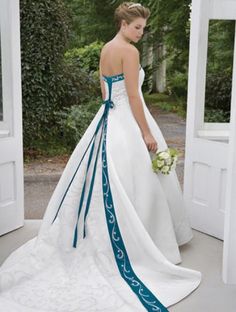 a woman in a white and blue wedding dress