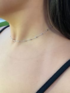 Genuine Beautiful trendy 14k white gold diamond cut/ moon cut choker chain.Perfectly worn dainty by itself or with other chains. Material: 14k solid white gold.Length: 16 inches long.Weight: Approximately 3 grams.Available in 18 inch too. Weight will be more for longer length chain. Shiny diamond cut design on each ball to give a beautiful sparkle.Comes in a nice box.Available in yellow and rose gold too. Adjustable Chain Diamond Choker Necklace, White Gold Adjustable Chain Choker Necklace, Fine Jewelry Silver Diamond Choker Necklace, Fine Jewelry Silver Diamond Choker, Silver Diamond Choker Necklace Fine Jewelry, Dainty Sterling Silver Diamond Cut Chain Necklace, Dainty Diamond Cut Sterling Silver Chain Necklace, Silver Diamond Choker Necklace, Dainty Silver Choker With Adjustable Chain