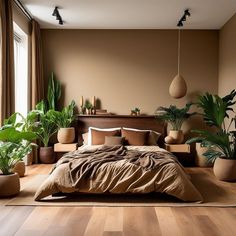 a bedroom with lots of plants in the corner