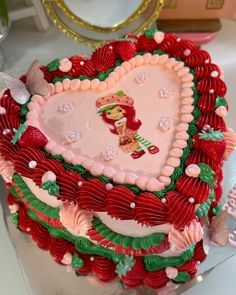 a heart shaped cake with decorations on it