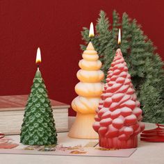 three candles sitting next to each other on a table