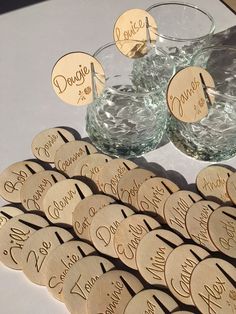 some wine corks are sitting on a table next to two glasses and one is filled with water