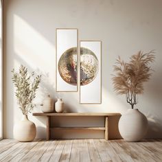 an empty room with three vases and two paintings hanging on the wall above it