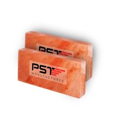 two orange soap bars with the words pst manufacturing printed on them, sitting side by side