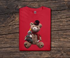 Want to add customization, and/or Love one of our designs but want it on a different product? Message us directly before purchasing.  Current items below (Prices vary) -Baby tees -Youth tees -Hoodies -Sweatshirts -Tank tops -Crop tops Get into the holiday spirit with this adorable Christmas Teddy Bear shirt! Featuring a cute teddy bear holding a small Christmas tree, dressed in a dapper hat and red scarf, this shirt brings festive cheer wherever you go. Perfect for holiday gatherings, gift-givin Teddy Bear Christmas Shirt, Casual Bear Print T-shirt For Streetwear, Casual Cotton T-shirt With Bear Design, White Crew Neck T-shirt With Bear Print, Affordable Casual T-shirt With Bear Design, Bebe T Shirt, Christmas Teddy Bear, Bear Shirt, Small Christmas Trees