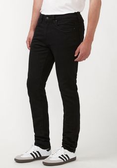 Step into style with the Skinny Max Men's Jeans in Midnight Wax. These striking jeans feature a unique crinkled dark denim finish, adding both texture and trendy attitude to your look. They are designed with a regular rise and a skinny fit that follows the leg to the hem, delivering a modern silhouette perfect for any fashion-forward guy. The classic five-pocket styling, complemented by a zip fly and a distinctive Buffalo rivet at the rear pocket, makes these jeans a timeless addition to your wa