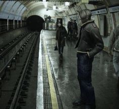 some people are standing in a train station