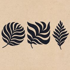 three leaf stencils are shown on a piece of brown paper with black ink