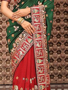 <ul>
<li style="text-align: justify;"><span data-preserver-spaces="true">Create style statement by draping silk panetar saree in dual color red and green with colored peacock, elephant, deer, kalash, swastik motifs on it border and also has heavy embellished pallu with doli/ baraat scene and saubhagyawati bhava written on lace elevate pallu border with thread tessels.  </span></li>
<li style="text-align: justify;"><span data-preserver-spaces="true Red Blouse With Embroidered Border For Festivals, Red Embroidered Blouse For Festivals, Wedding Blouse With Embroidered Border And Traditional Drape, Traditional Wedding Blouse With Embroidered Border, Traditional Drape Wedding Blouse With Embroidered Border, Red Motif Blouse For Traditional Ceremonies, Traditional Red Blouse With Embroidered Border, Red Choli With Embroidered Border For Wedding, Red Embroidered Choli For Wedding