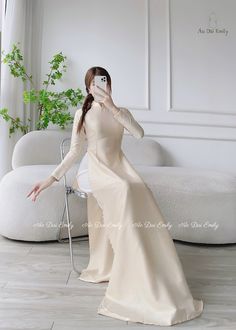 🌻Material: Lụa vân gỗ 🌻Stretchy level: 2/10 🌻 The measurement of this ao dai (long dress) is in Vietnamese size (American size tends to be bigger for the same size). Please LOOK AT THE SIZE CHART CAREFULLY BEFORE ORDERING. There might have some chalk writings on the fabric due to making process. These marks can be washed away easily. 🌻🌻No returns or exchanges Buyer can contact seller about any issues with an order. 🌸 Follow us Facebook/aodaiemily www.aodaiemily.com 💜 Thank you very much💜 Champagne Ao Dai, Elegant Long Sleeve Ao Dai For Wedding, Elegant Ao Dai For Spring Wedding, Elegant Wedding Ao Dai For Spring, Elegant Fitted Long Ao Dai, Fitted Long Ao Dai For Banquet, Elegant Wedding Ao Dai For Festive Occasion, Elegant Ao Dai For Wedding, Full Length Fitted Ao Dai For Wedding