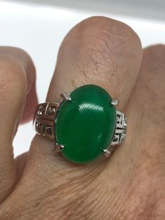 Large green nephrite jade Ornate German Silver Vintage ring, does not tarnish, NOT sterling Size 7, 8, 8.5, or 9 All rings are shipped in a nice gift box. Check out our over a THOUSAND great reviews Engraving is $4 per letter and is not always perfect depending on the piece. It can take a few days if the jeweler is busy. This is payable to Paypal Judithsltd@gmail.com Classic Green Jade Jewelry, Polished Chrysoprase Ring Suitable For Gift, Green Jade Ring As A Gift, Green Jade Ring For Gift, Green Jade Ring Suitable For Gift, Green Cabochon Emerald Ring For Anniversary, Green Oval Cabochon Ring For Gift, Green Oval Cabochon Ring For Anniversary, Green Emerald Cabochon Ring For Anniversary