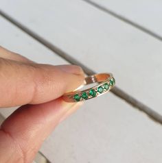 Solid gold ring, Gold Emerald ring, Green Emerald ring, half eternity ring, stacking ring mom, birthstone ring, 14k gold ring, 9k gold ring Handmade delicate Green Emerald stacking ring, stoned with 7 beautiful clear diamond shaped, faceted gemstones. This multistone half eternity ring is beautiful alone or stacked together with other rings and is delicate and pretty on your finger. The ring is available in nickel free, 14k gold plating on a brass or silver base, as well as solid sterling silver Gold Emerald Ring, Gold Pinky Ring, Green Emerald Ring, Emerald Ring Gold, Solid Gold Ring, Etsy Gold Ring, Half Eternity Ring, Ring Stacking, Solid Gold Rings