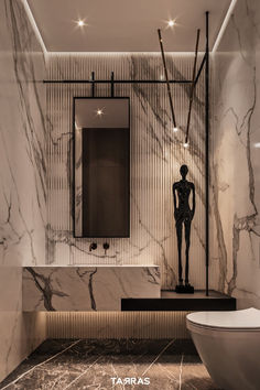 a bathroom with marble walls and flooring in the shape of a woman standing next to a bathtub