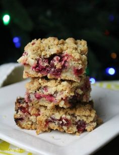 three cranberry oatmeal breakfast bars stacked on top of each other