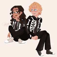 two people sitting next to each other in black and white outfits with skeleton print on them