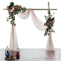 an arch decorated with flowers and greenery for a wedding ceremony or party, set up in front of a white background