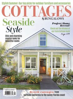 the front cover of cottages seaside style magazine with a bicycle parked in front of it