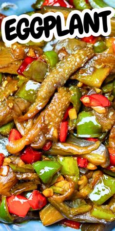 an eggplant stir fry with peppers and other vegetables on a blue platter