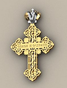 an ornate cross with a crown on top is shown in gold and silver, against a gray background