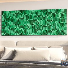 a large green piece of art hanging on the wall above a bed in a bedroom