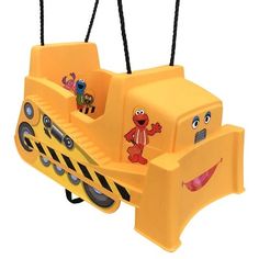 a yellow children's swing with cartoon characters on it