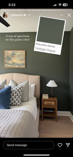 a bedroom with green walls and white bedding