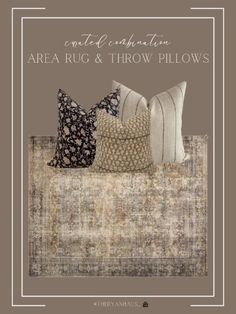 three pillows sitting on top of a couch in front of a white framed sign that says,