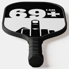 a close up of a black and white paddle with the number 899 on it