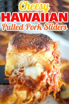 a piece of cheesy hawaiian pulled pork sliders on a white plate with a fork