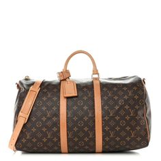 This is an authentic LOUIS VUITTON Monogram Keepall Bandouliere 50. This stylish duffel is crafted of signature Louis Vuitton monogram toile canvas. This bag features vachetta cowhide leather trim including rolled top handles, an optional adjustable shoulder strap, and straps around the midline and side panels.The polished gold plated top zipper opens to a spacious cocoa brown fabric interior with a hanging zipper pocket. Cocoa Brown, Brown Fabric, Side Panels, Leather Trim, Authentic Louis Vuitton, Panel Siding, Cowhide Leather, Leather Trims, Louis Vuitton Monogram