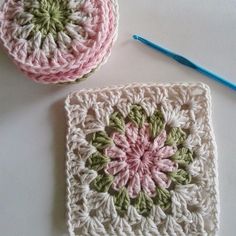 two crocheted grannys are sitting next to each other