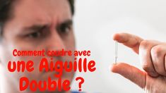 a man holding a tiny needle in his right hand with the words comment courre ave une aiguille double?