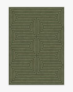 a square rug with an abstract design in green