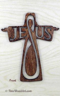 a wooden cross with the word jesus on it