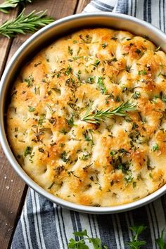 a casserole dish with cheese and herbs